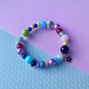 Handmade beaded statement bracelet with flower charm
